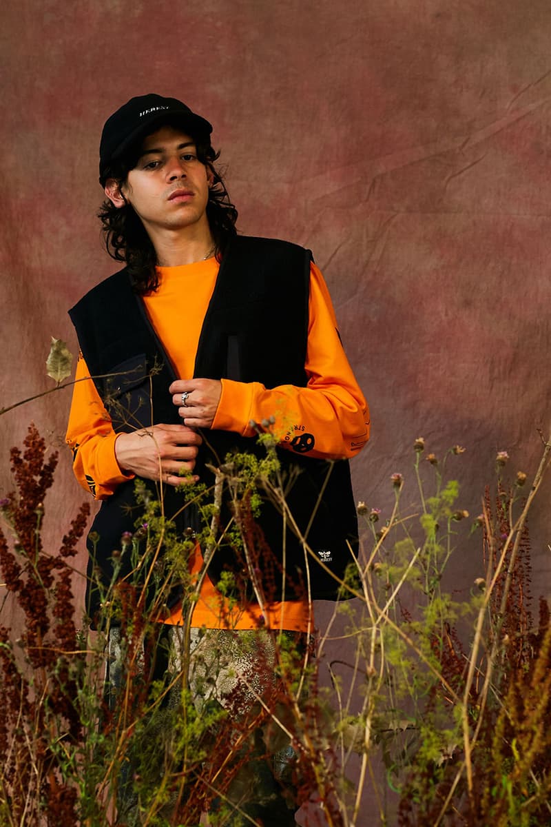 HERESY Fall Winter 2019 FW19 Collection Lookbook Arktis Collaboration "Growing" Folk Nomadic Prints Designs Blanket Scarf Outerwear Coats Camouflage Print Workwear Gloves Hats