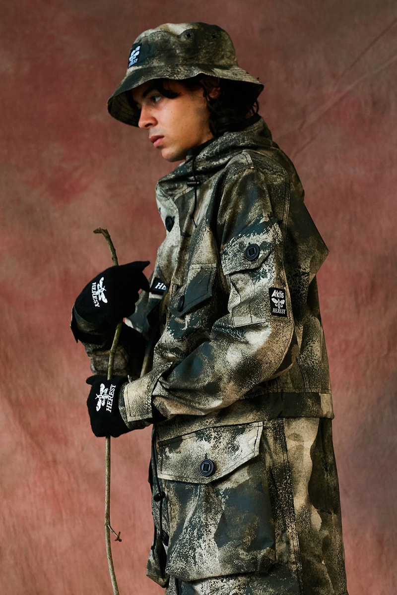 HERESY Fall Winter 2019 FW19 Collection Lookbook Arktis Collaboration "Growing" Folk Nomadic Prints Designs Blanket Scarf Outerwear Coats Camouflage Print Workwear Gloves Hats 