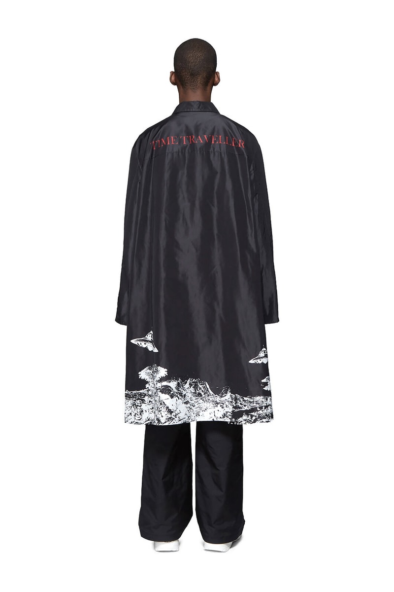Valentino Time Traveller Coat in Black Logo Trench Coat in Beige graphics ufo flying saucers white red serif font undercover cape concealed central opening 