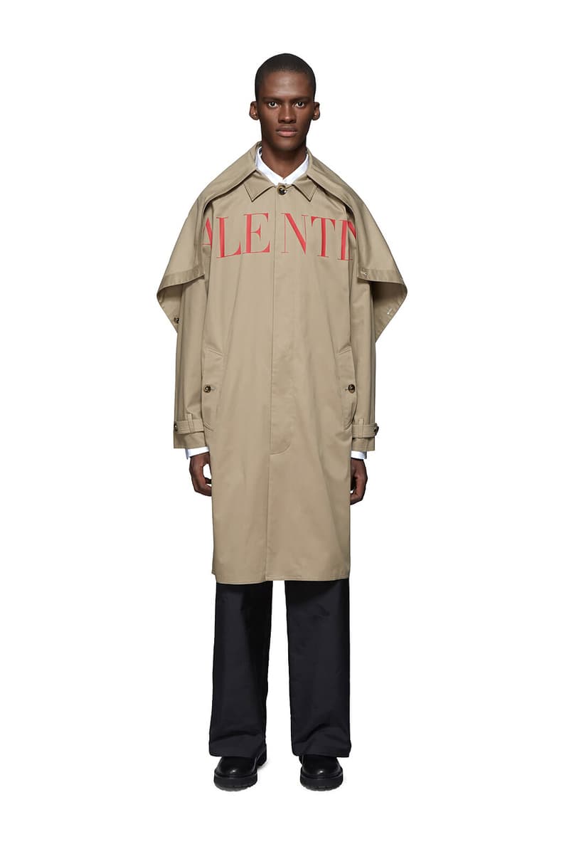 Valentino Time Traveller Coat in Black Logo Trench Coat in Beige graphics ufo flying saucers white red serif font undercover cape concealed central opening