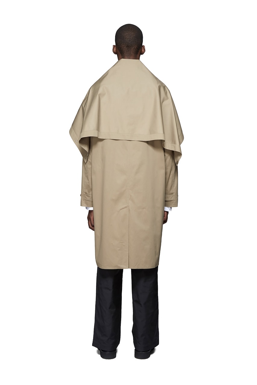 Valentino Time Traveller Coat in Black Logo Trench Coat in Beige graphics ufo flying saucers white red serif font undercover cape concealed central opening 