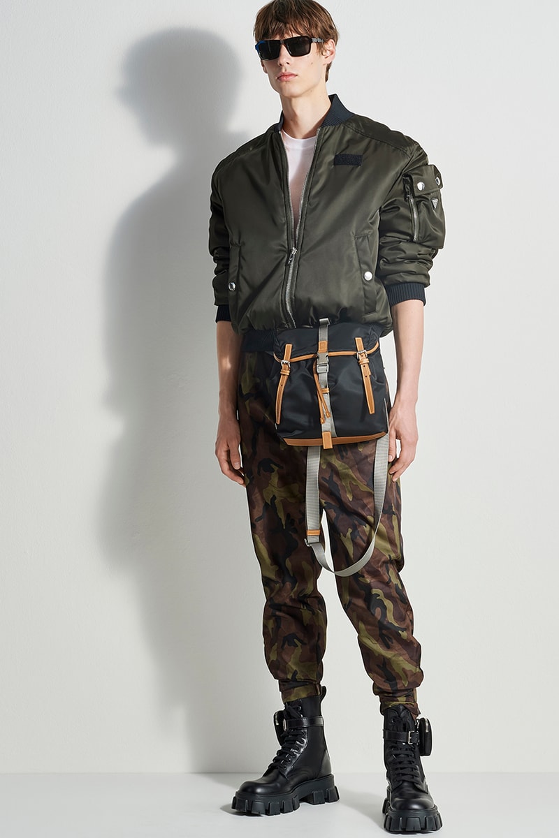 prada escape selfridges apparel sneakers camouflage shirts boots accessories water bottles outdoor practical themed design store space first look buy cop purchase