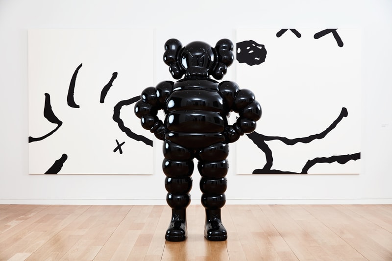 kaws he eats alone exhibition doha fire station museum qatar artworks paintings companion sculptures 