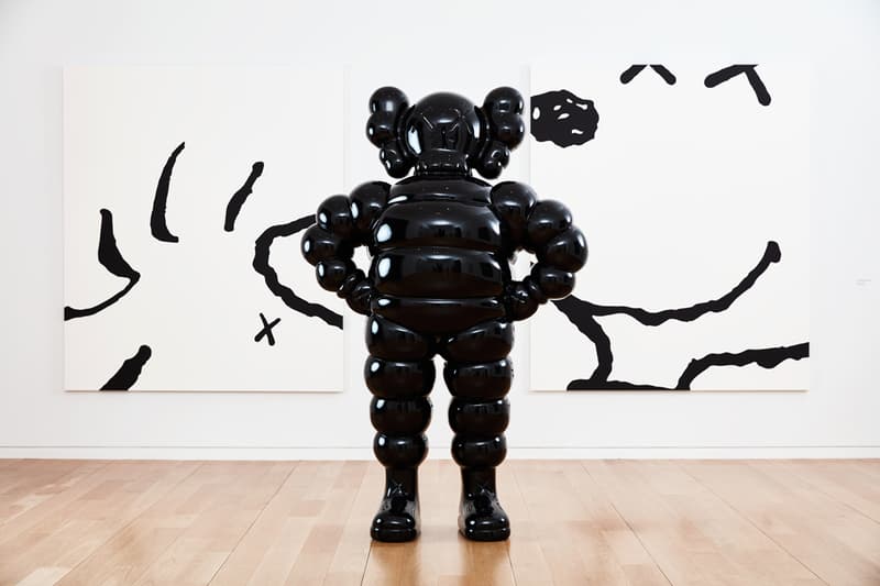 kaws he eats alone exhibition doha fire station museum qatar artworks paintings companion sculptures
