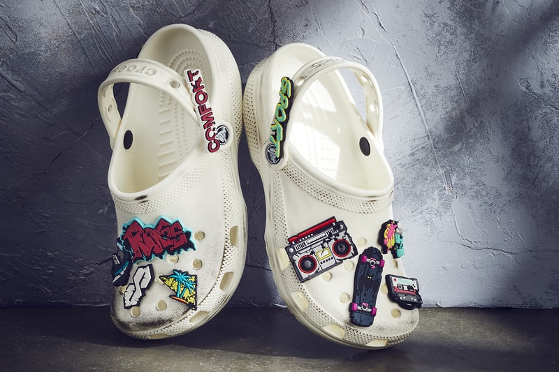 Ruby Rose x Crocs Classic Clog Release limited edition batwoman all white distressed look spray paint cans Jibbitz™ charms