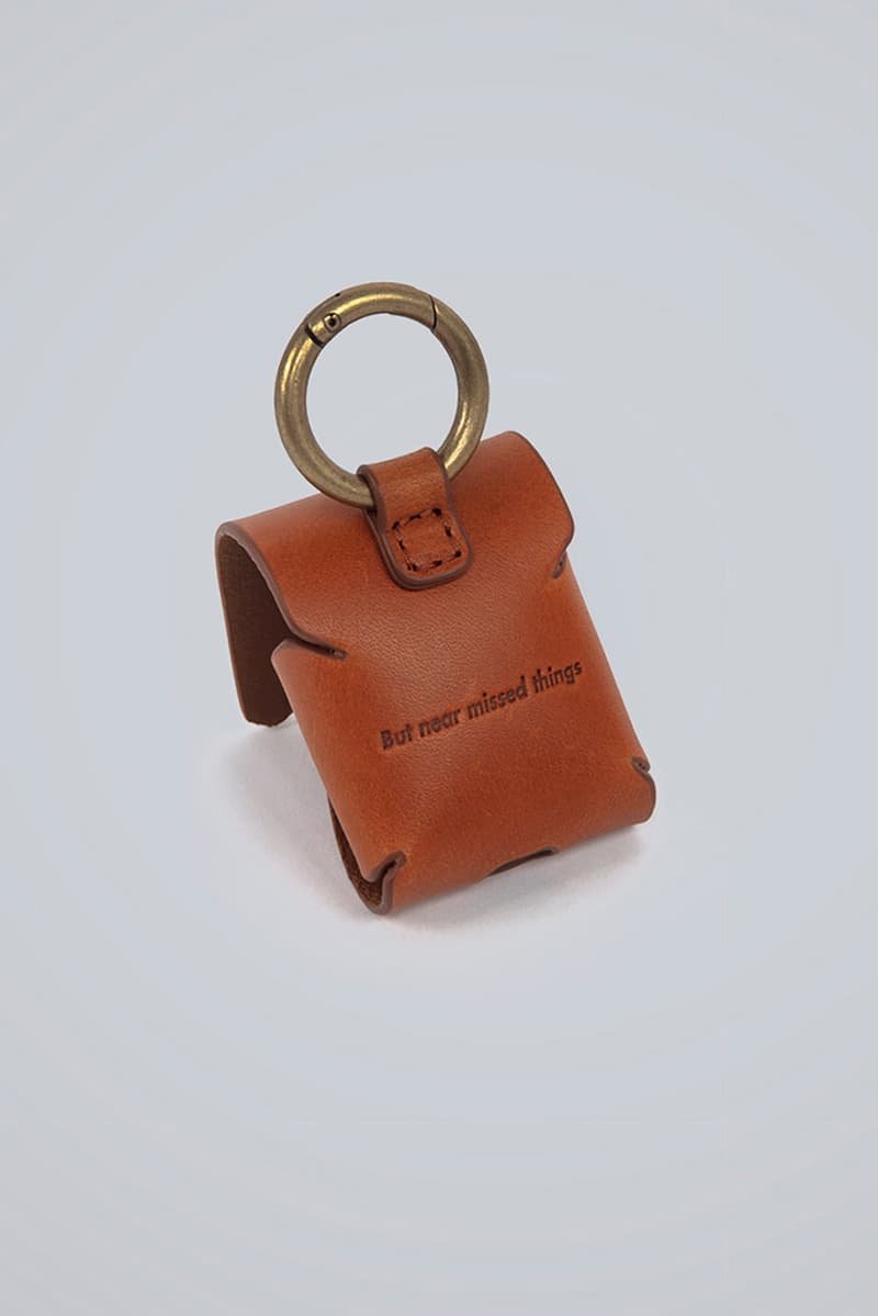 ADER error Airpod Cases Release First Look Translucent Jelly Signature Tetris Logo Brown Leather cinder cutting detail Trouser Ring Attachment Diagonal Branding But Near Missed Things Mainlabel White Clear