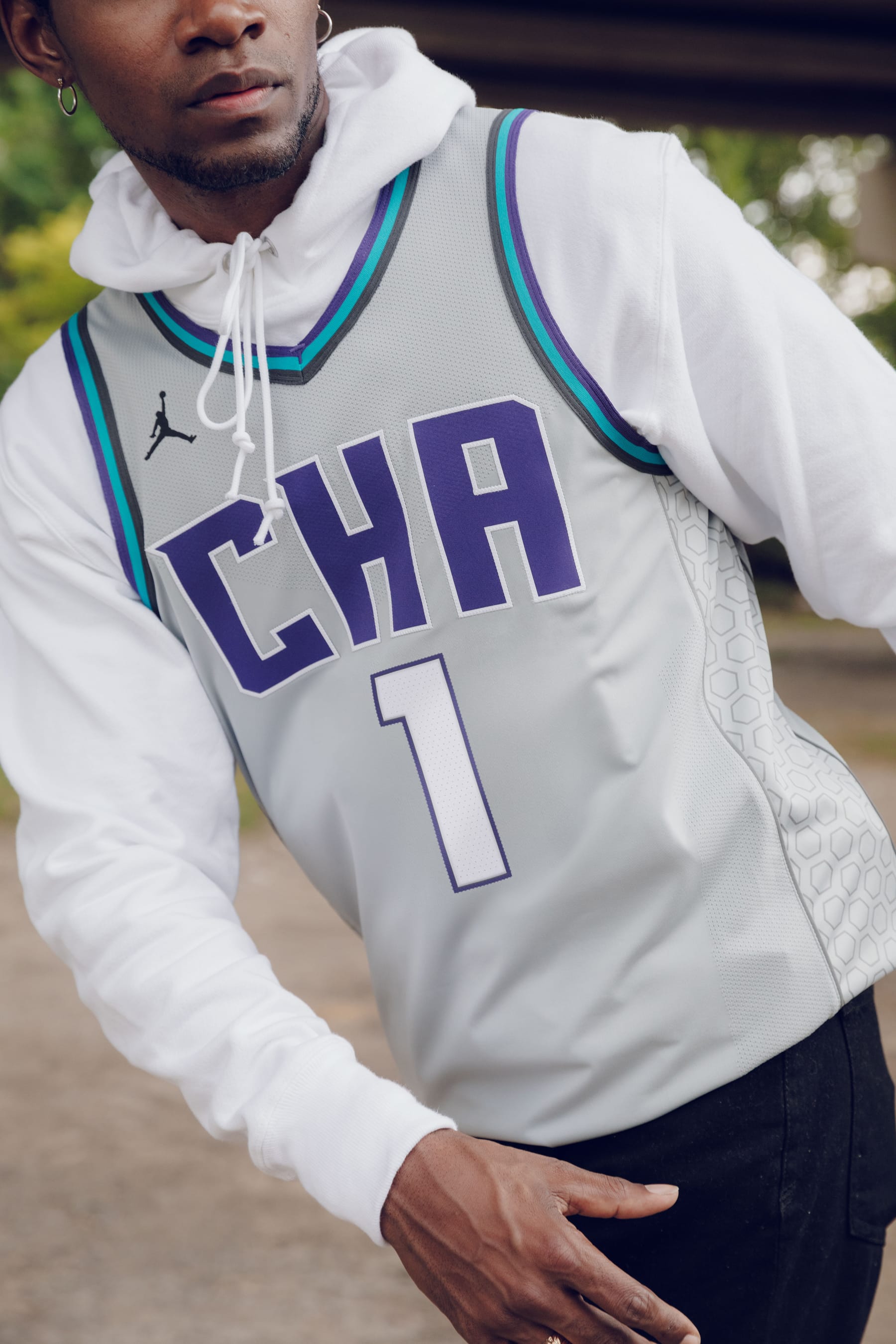 basketball jersey over a hoodie