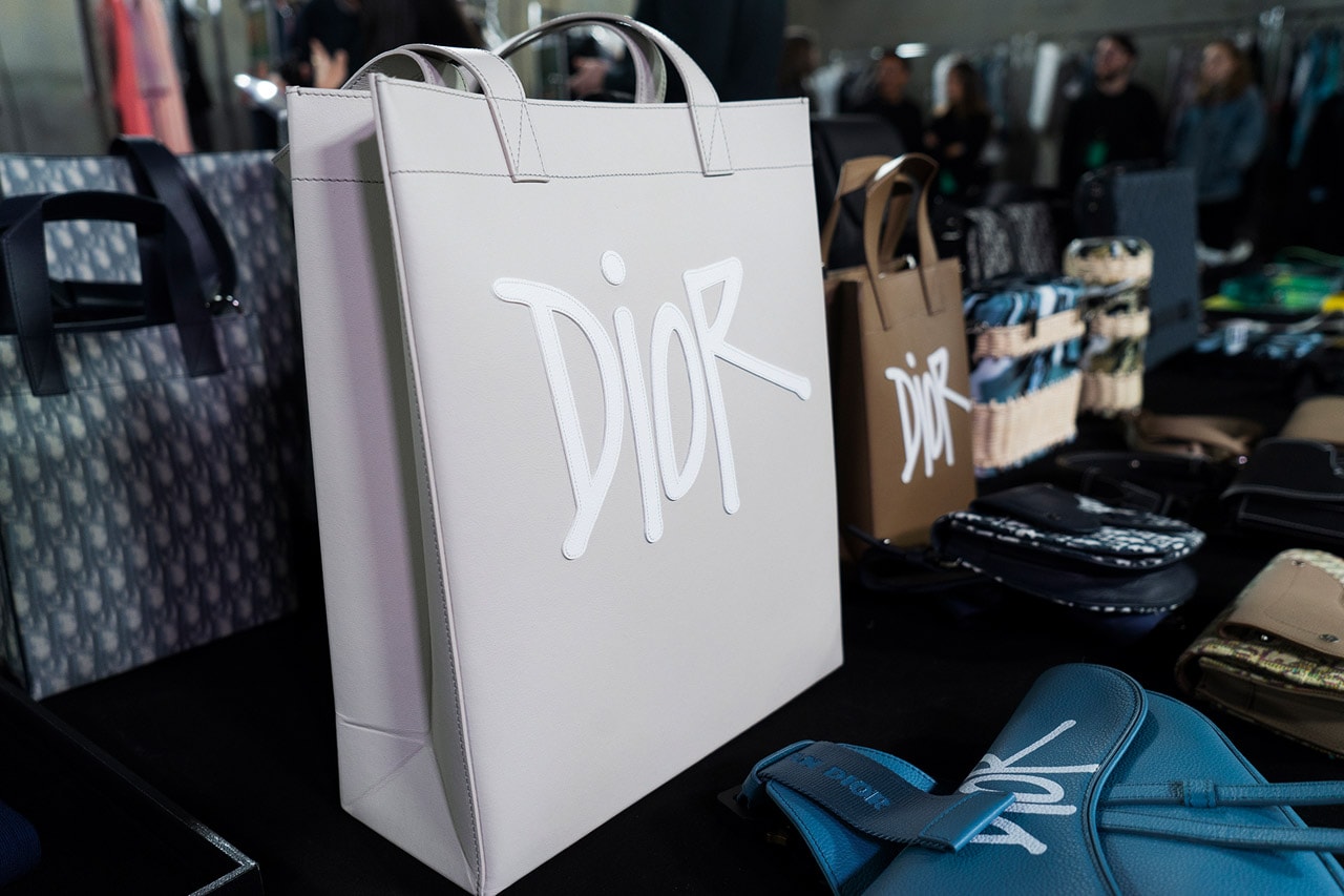 Backstage at Diors Fall Winter 2020 Miami Preview shawn stussy beach architecture couturier yoon ahn ambush jewelry French luxury house American art basel collaboration logo saddle bag pre