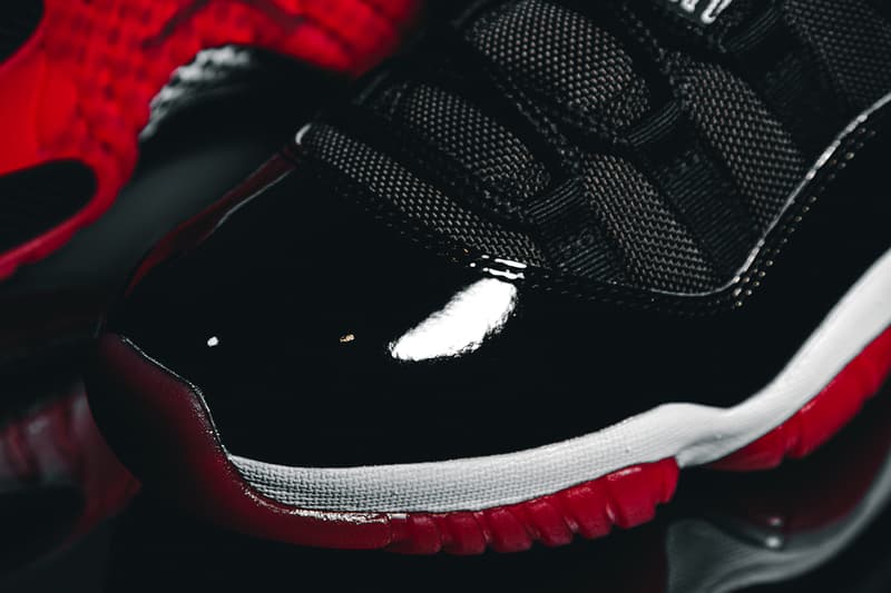 Nike Air Jordan 11 "Bred" Closer Look Editorial 2019 HYPEBEAST In Hand Footwear MJ Michael Jordan Basketball 1996 Recreation Drop SNKRS App Release Information #23 Patent Leather Black Red White