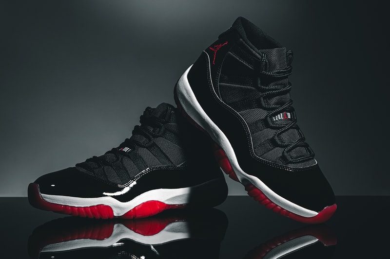 Nike Air Jordan 11 "Bred" Closer Look Editorial 2019 HYPEBEAST In Hand Footwear MJ Michael Jordan Basketball 1996 Recreation Drop SNKRS App Release Information #23 Patent Leather Black Red White