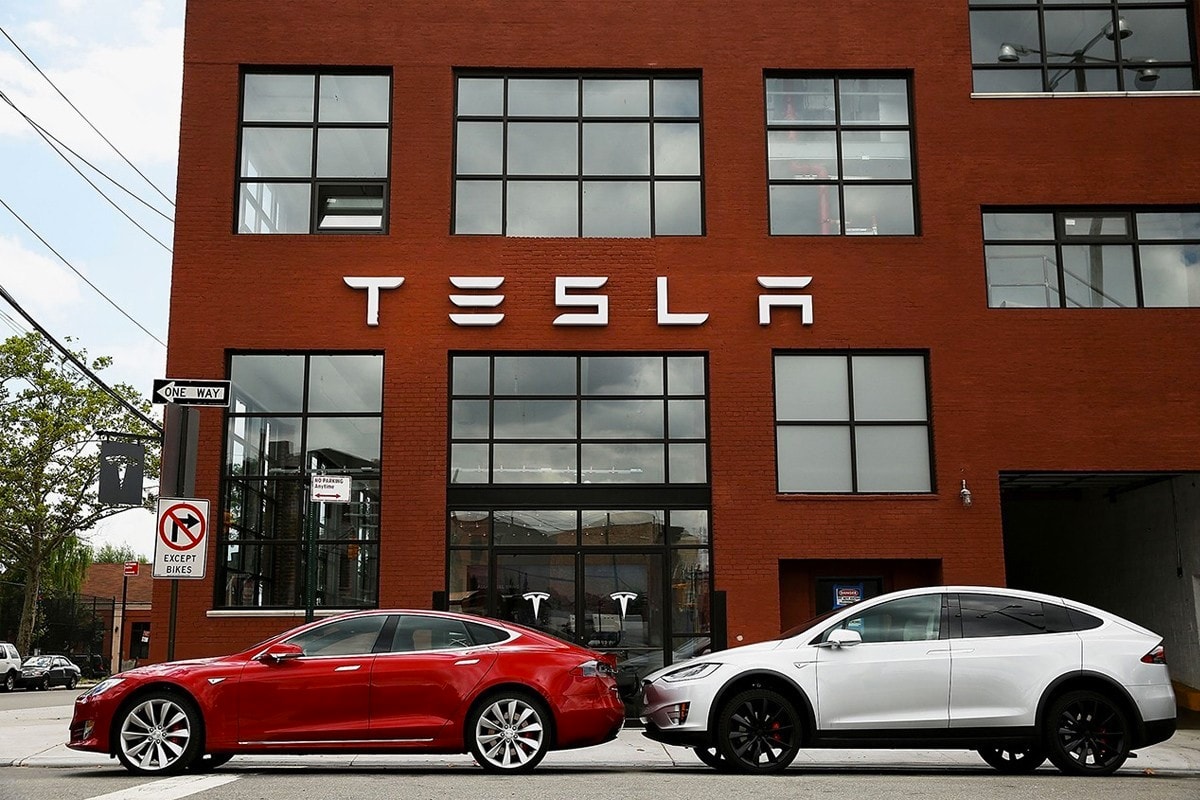 tesla elon musk electric cars vehicles stock price record high wall street investment 
