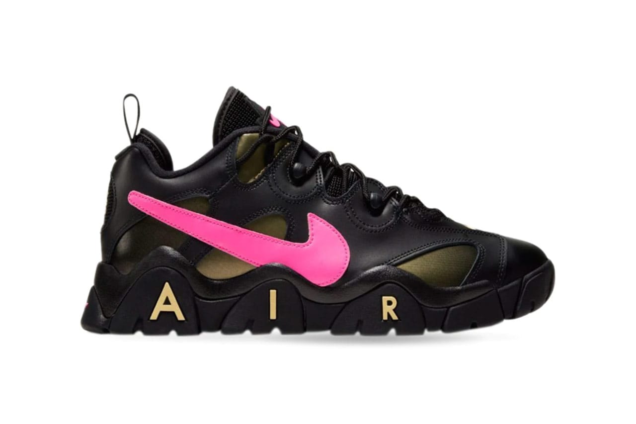 black nike shoes with pink tick