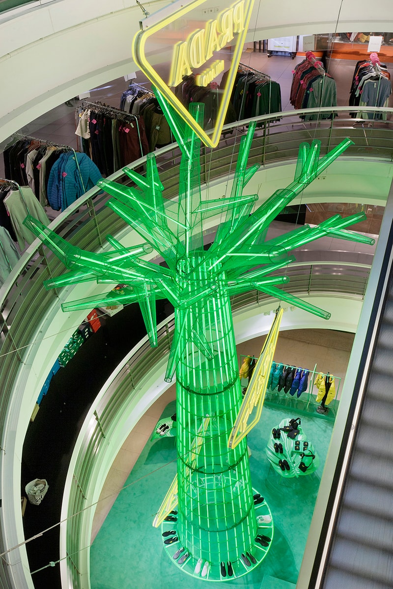 Prada Takes Over Galeries Lafayette Hyper Leaves Retail Installation paris fall winter 2020 collection footwear nature tropical neon green signs