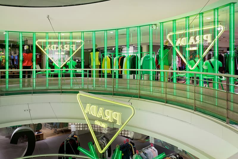 Prada Takes Over Galeries Lafayette Hyper Leaves Retail Installation paris fall winter 2020 collection footwear nature tropical neon green signs