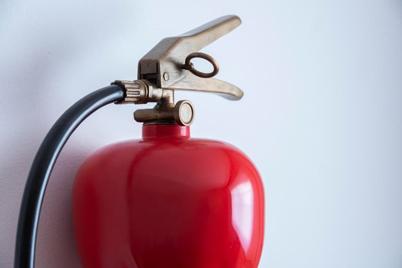 Alex Chinneck Twisted Fire Extinguisher Sculpture Knot Red Painted Patinated Waxed Bronze