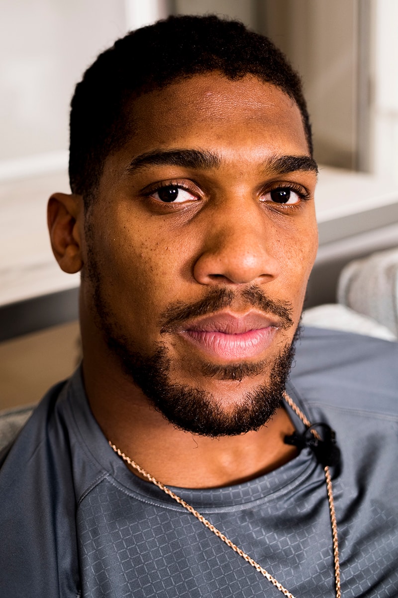 Streetsnaps Anthony Joshua British Boxing Heavyweight Champion Boxer London Photography Fashion Shoot Under Armour Pendant Chain Necklace Sony PS4 PlayStation 4 Louis Vuitton Accessories Interview Akademiks Tracksuit Wembley Market Von Dutch Air Force 1 Christian Louboutin Hugo Boss T-Shirts Derek Rose Range Rover