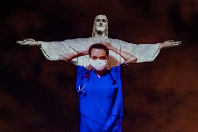 Rio de Janeiro’s ‘Christ the Redeemer Statue’ Illuminated With Portraits of Healthcare Workers