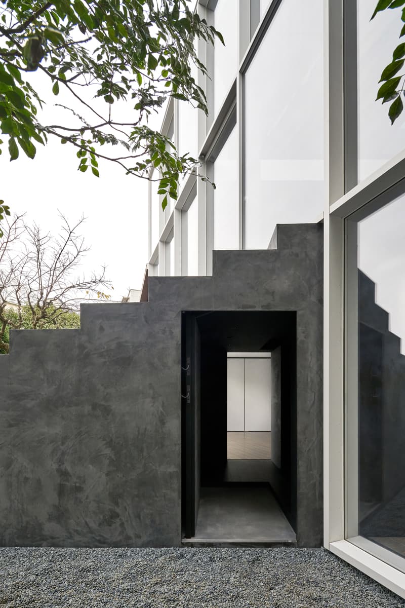 nendo Stairway House Design Shinjuku Tokyo Staircase Plants Steps Steel Concrete Windowless Facade White Black Furniture