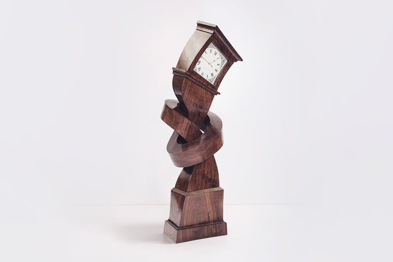 alex chinneck surreal grandfather clock sculpture Hickory dickory hokey cokey