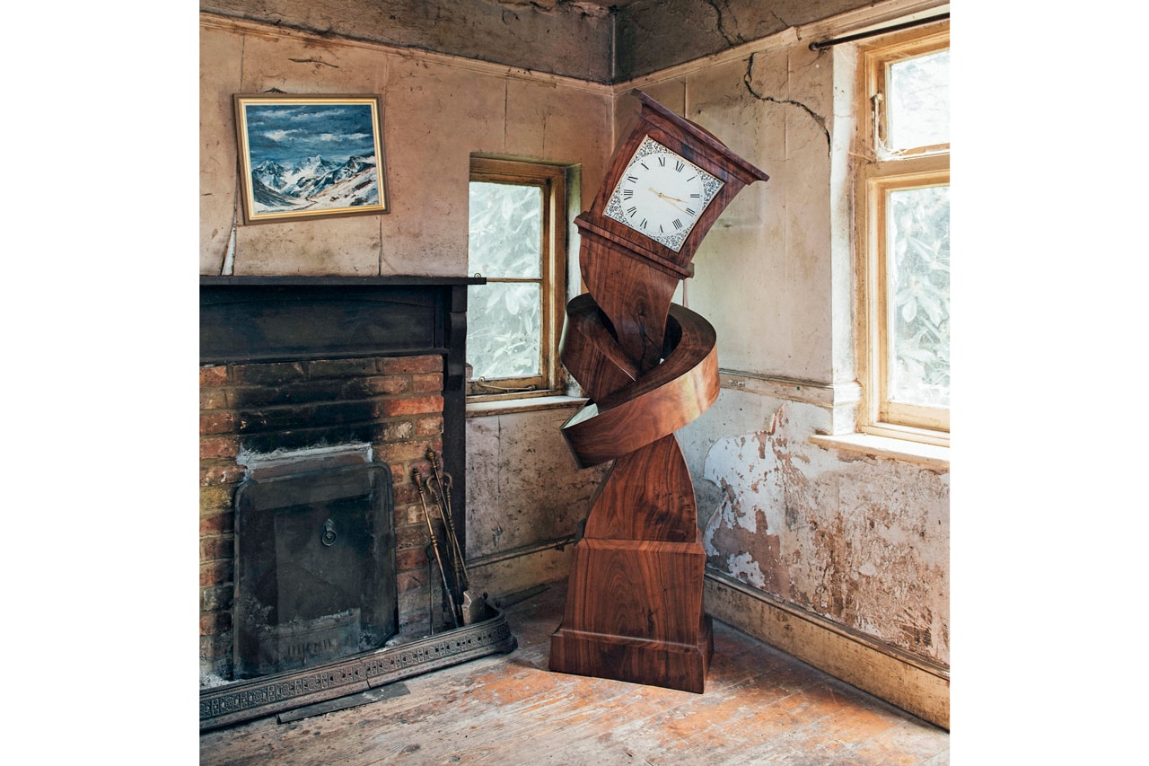 alex chinneck surreal grandfather clock sculpture Hickory dickory hokey cokey