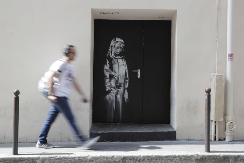 Banksy Bataclan Mural Found in Italy Paris Terrorist Attacks Theater Girl Mourning Door
