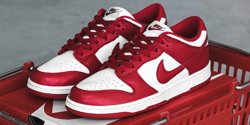 white and red dunks on feet