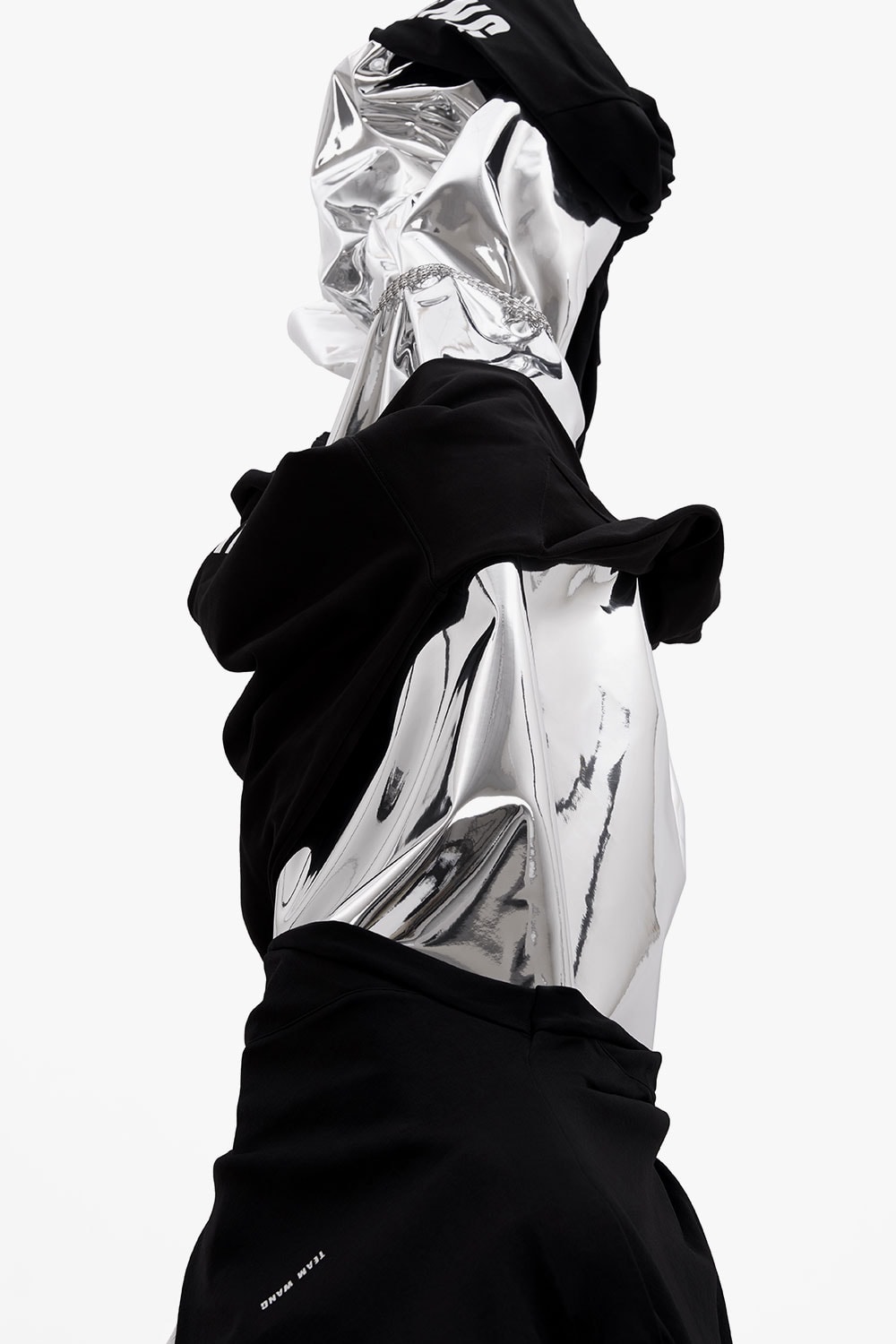 team Jackson wang Hong Kong native music artist rapper debut collection monochromatic black gear vest pleated shorts
