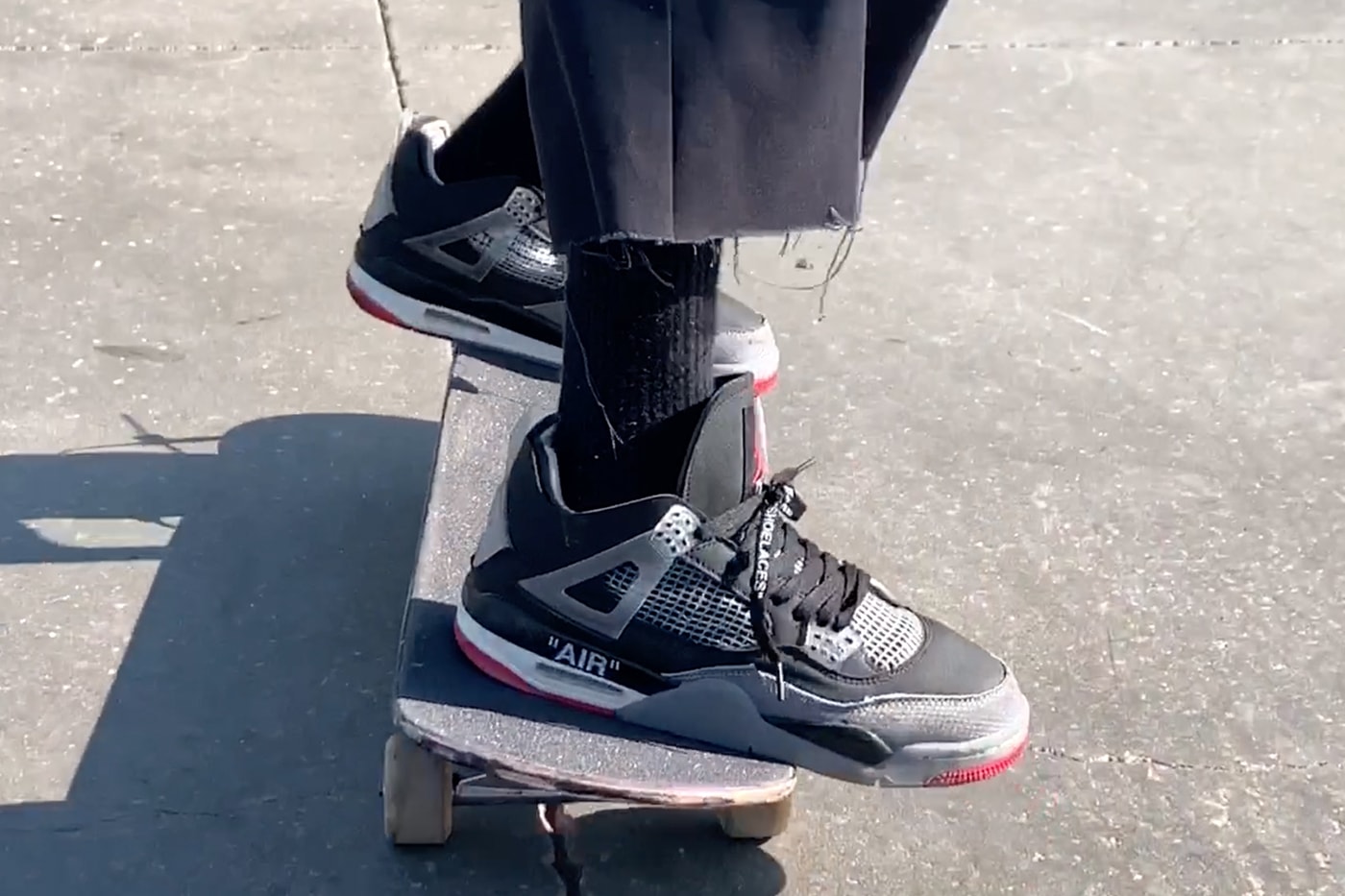 Burberry.Erry Skates in Unreleased Off-White™ x Air Jordan 4 Bred 