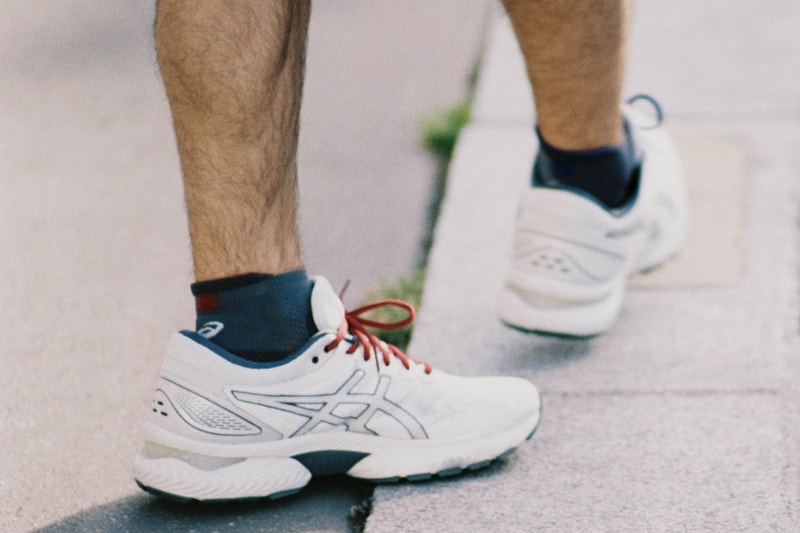 reigning champ asics gel nimbus 22 paris edition running collection singlet shorts t shirt hoodie 1021A516 020 polar shade carrier grey red navy blue Andre Saraiva