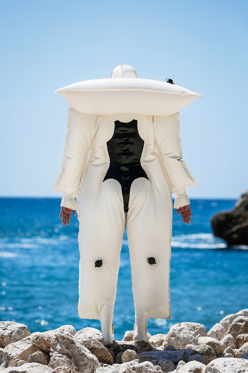 siigii inflatable lilo latex suit floating on water design Spanish artist floating point