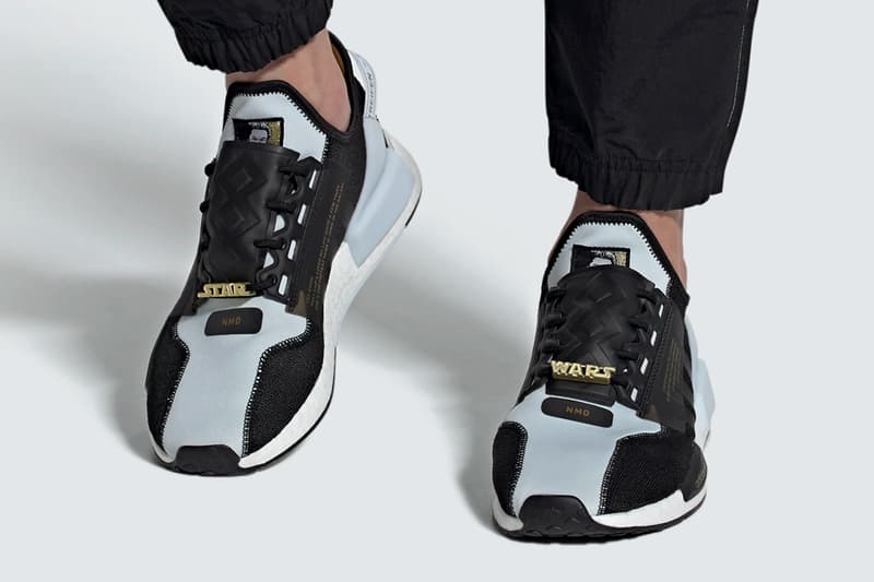 Download Adidas Nmd R1 V2 Black And Gold Background