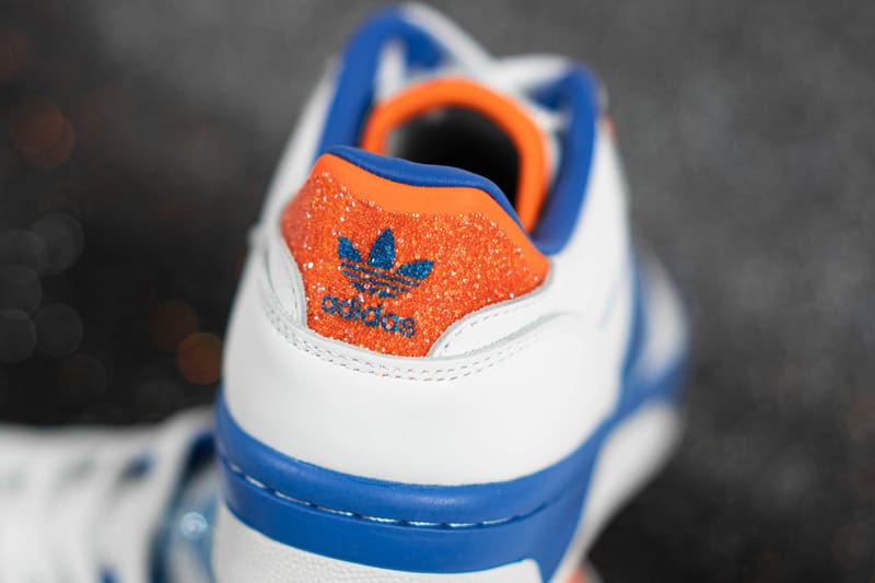 adidas trainers blue with orange stripes