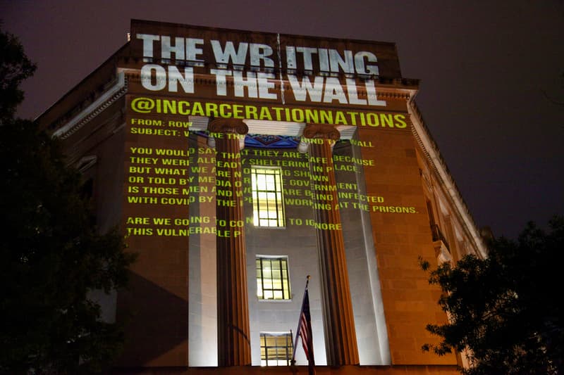 hank willis thomas the writing on the wall projection incarceration nations network brooklyn public library