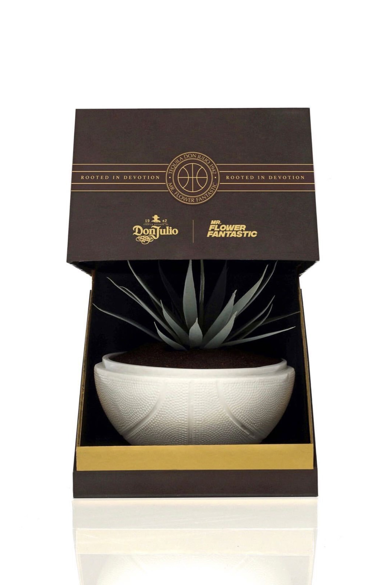 synthetic placement plant bilingual planting instructions in both English and Spanish, a certificate of authenticity custom designed protective housing encasement Tequila Don Julio 1942 packaging NBA creative community agave planter