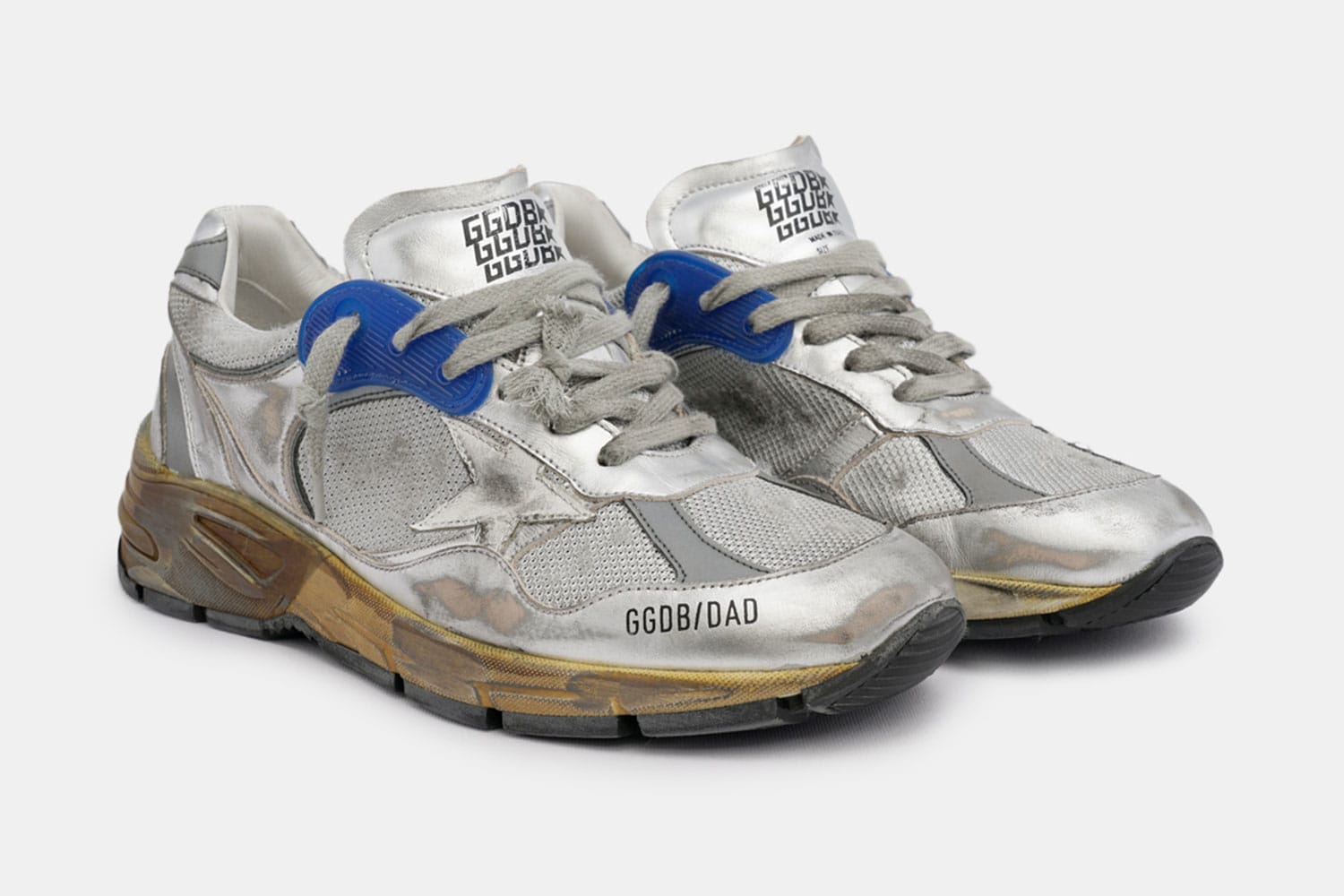 gold and silver golden goose sneakers