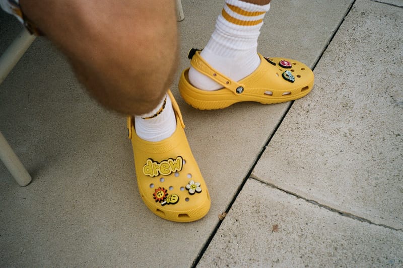 yellow crocs on feet