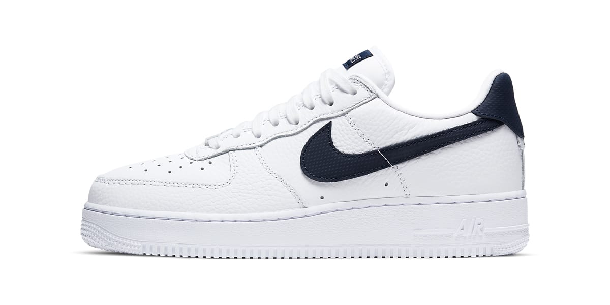 white and navy blue air forces