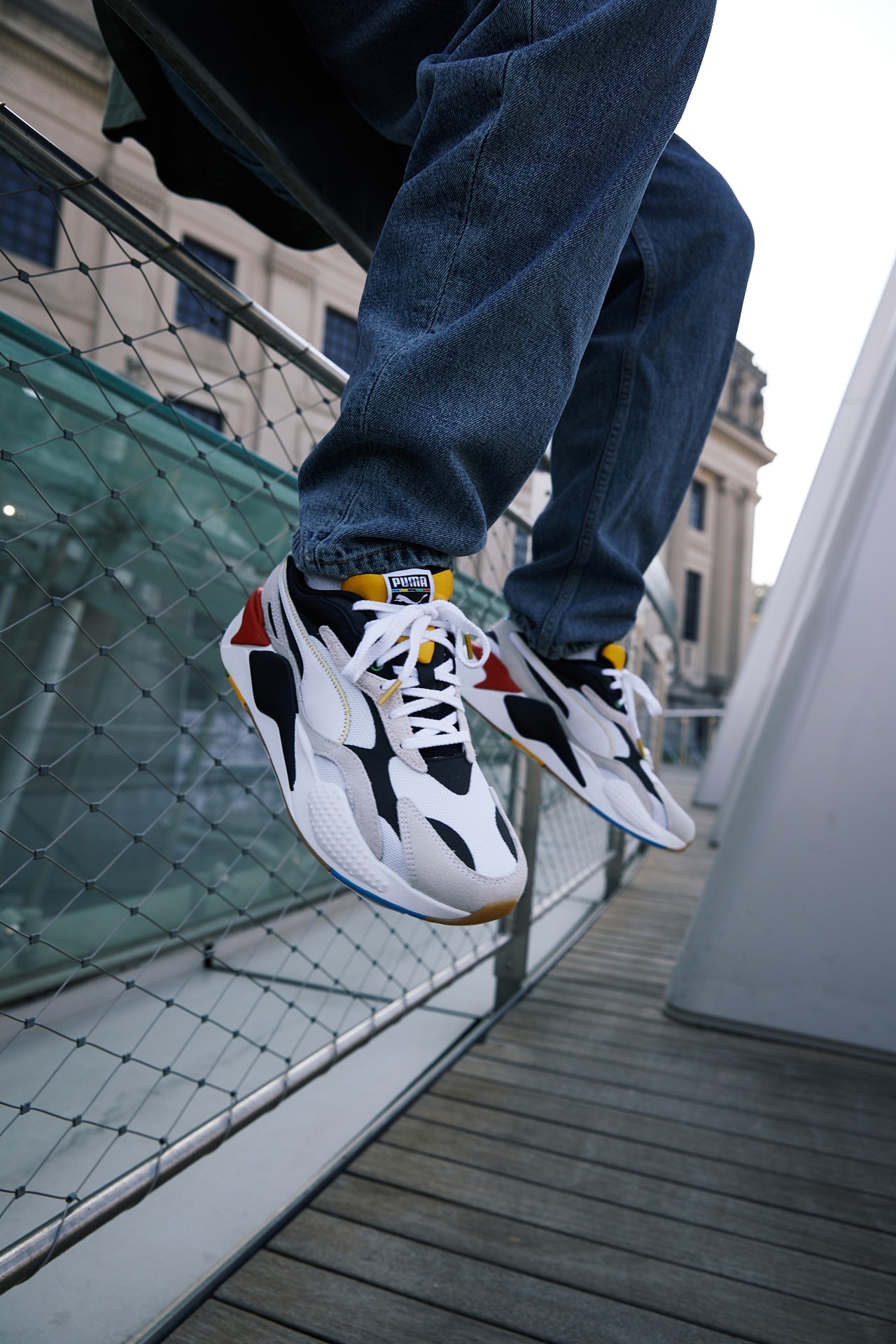 PUMA RS-X³ WH model Salvatore Ferragamo slip-on sneakers horsebit logo red tag on the upper, blue heel tab and yellow tongue unify collection retro future ridged rubber sole and round toe black and gold toned luxury casual options platform sneaker mens womens