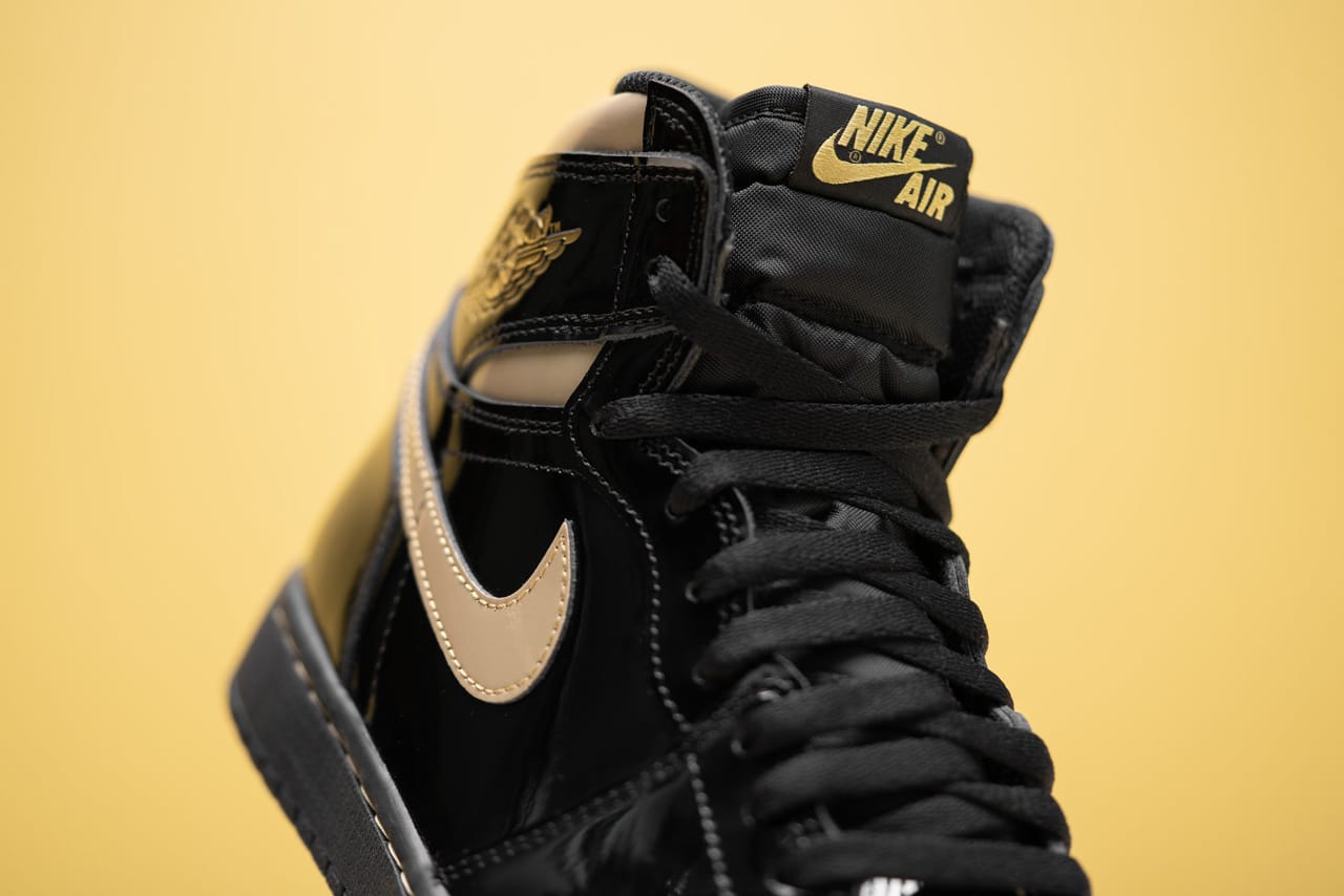 black and gold patent leather jordan ones