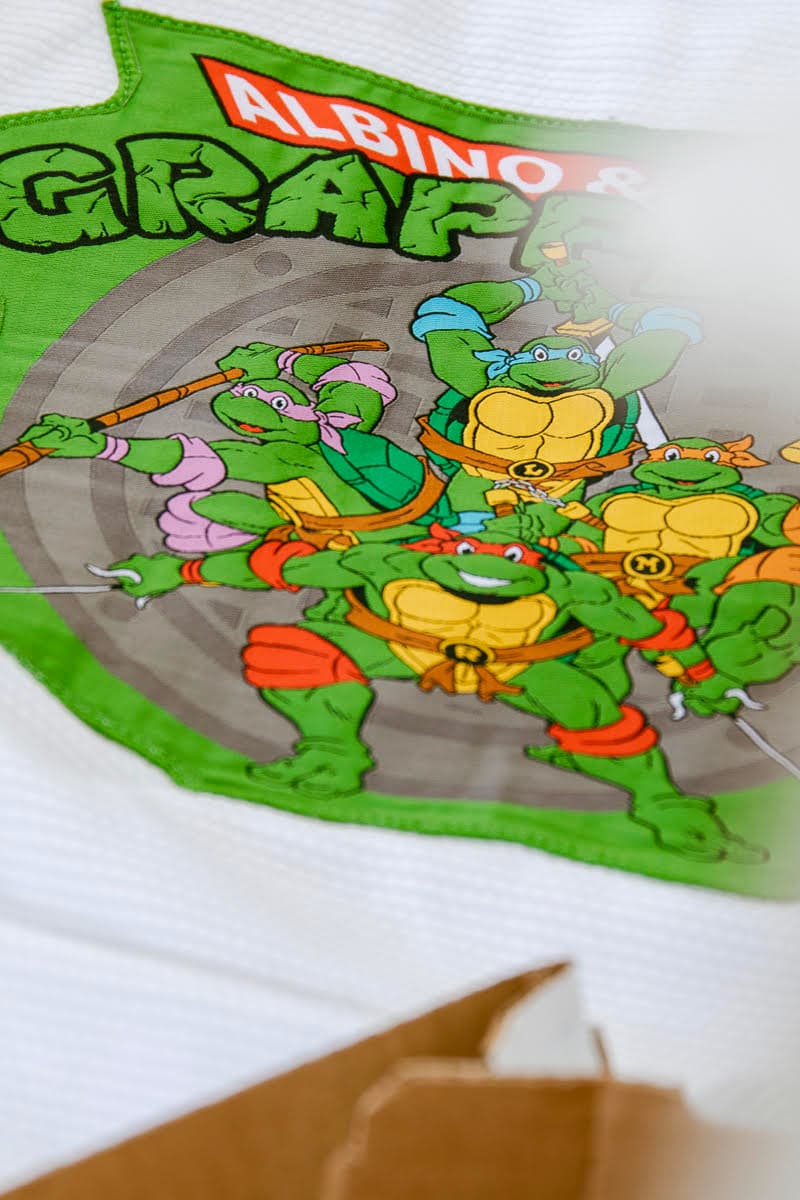 Teenage Mutant Ninja Turtles Albino & Preto Collection Release Info Gi T shirt Nickelodeon