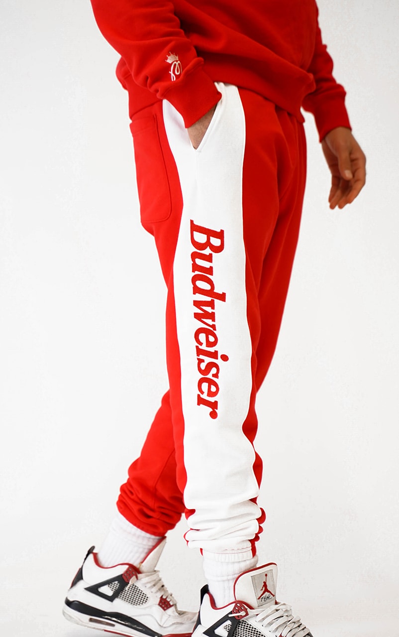 Malbon Golf Launches a Budweiser Collection that consist of a sweatshirt, pants, headcover, golf bag and polo