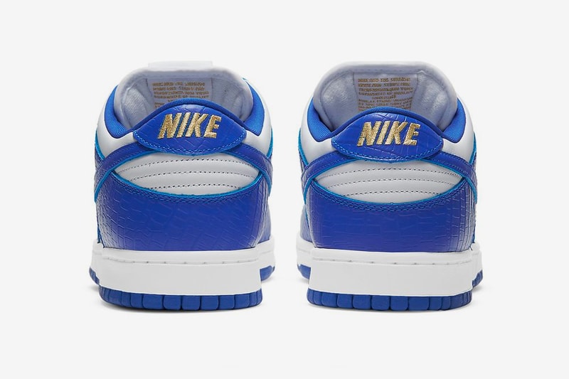 supreme nike sb dunk low white hyper royal metallic gold collaboration release info date photos store list buying guide world famous stars 