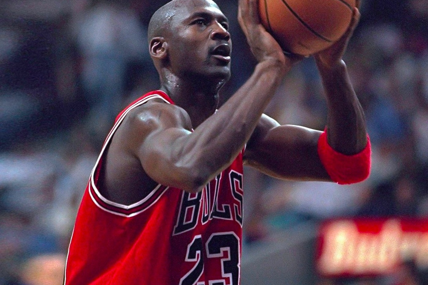 Download Michael Jordan in His Classic Red Jersey Wallpaper