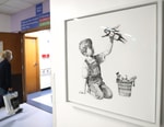Banksy's 'Game Changer' Sets New Auction World Record at $23 Million USD