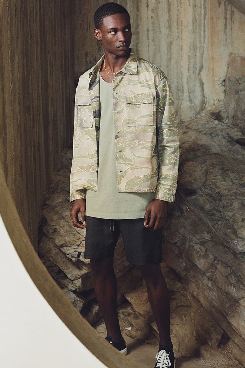 john elliott where the concrete meets the earth ss21 collection release info store list buying guide photos price tiger camo trench hand painted denim fleece edition one runner 