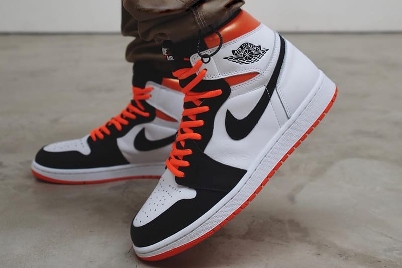 orange white and black jordan 1