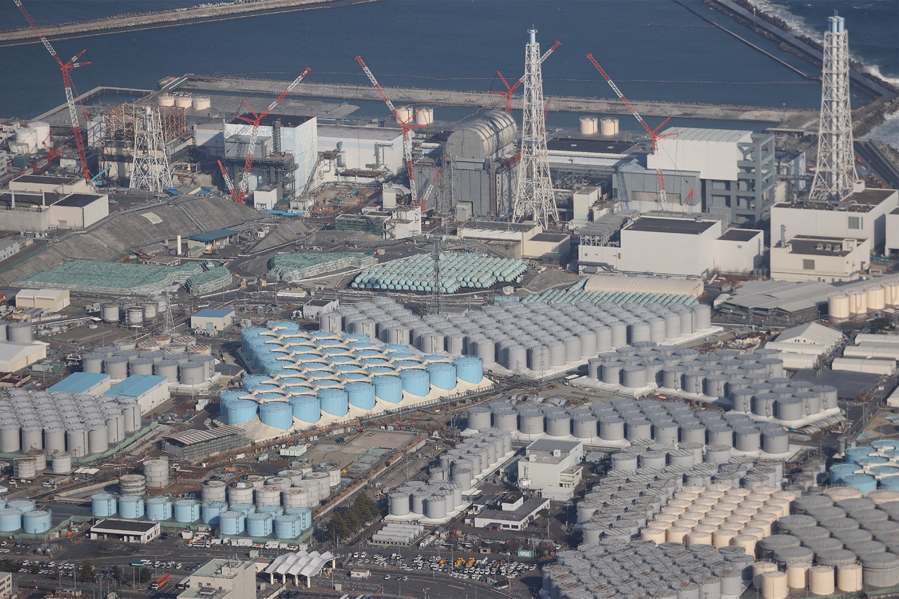 Japan fukushima nuclear plant water release into sea 2023 news Tokyo Electric Power Company Holdings In tritium reactor asia Japan Yoshihide Suga environment World Health Organization