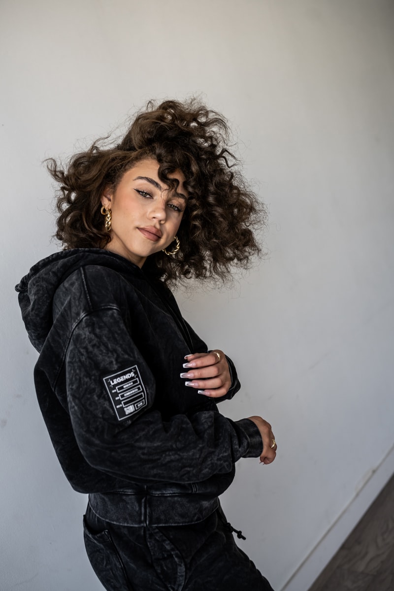 Fairfax Lifestyle designed, materialized and manufactured all in LA black, washed black and natural white shorts, shirts and more womens line versatility unisex 100% cotton heavy weight fleece soft hand feel with Garment dyed solid colors and a mineral wash ribbed cuff and hem details, dipped cotton drawcords embroidery patches right leg right sleeve elevated, graphic finish 