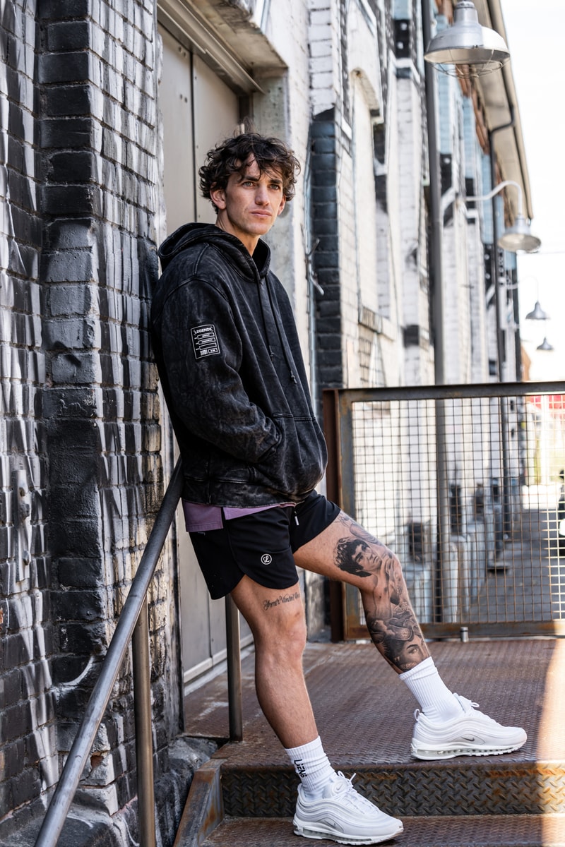 Fairfax Lifestyle designed, materialized and manufactured all in LA black, washed black and natural white shorts, shirts and more womens line versatility unisex 100% cotton heavy weight fleece soft hand feel with Garment dyed solid colors and a mineral wash ribbed cuff and hem details, dipped cotton drawcords embroidery patches right leg right sleeve elevated, graphic finish 