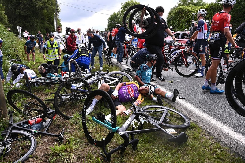 sign holding spectator tour de france crash evades French police news germany cycling sports